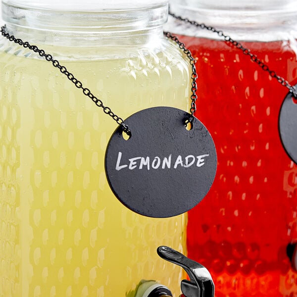 A jar of lemonade with a Choice oval chalkboard sign on it.