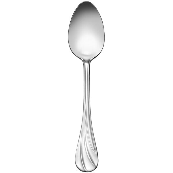 A Libbey stainless steel serving spoon with a curved handle.