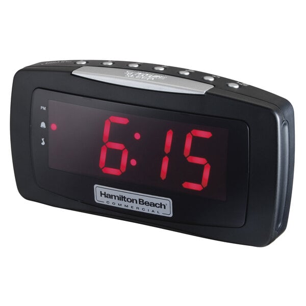 A black Hamilton Beach digital alarm clock with red numbers displaying the time.