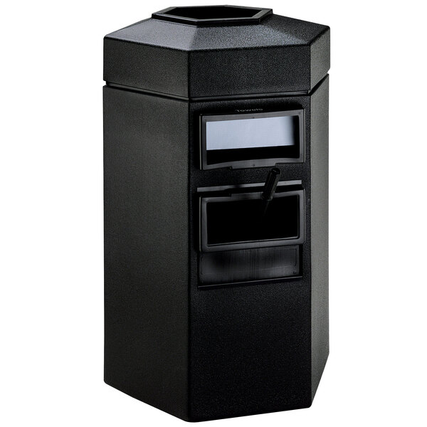 A black hexagonal waste container with a door on top.