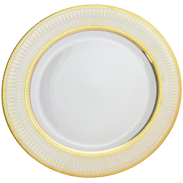 A close up of a white 10 Strawberry Street Iriana porcelain salad/dessert plate with gold trim.