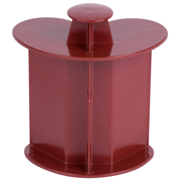 A red plastic pusher for a Robot Coupe commercial food processor.