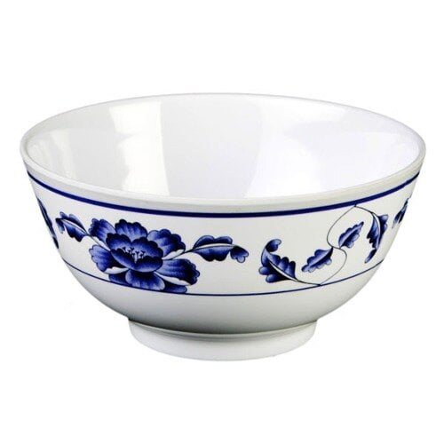 A white Thunder Group melamine bowl with blue lotus flowers on it.