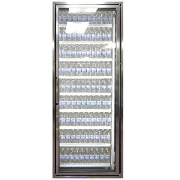 A Styleline walk-in cooler door with shelving filled with water bottles.