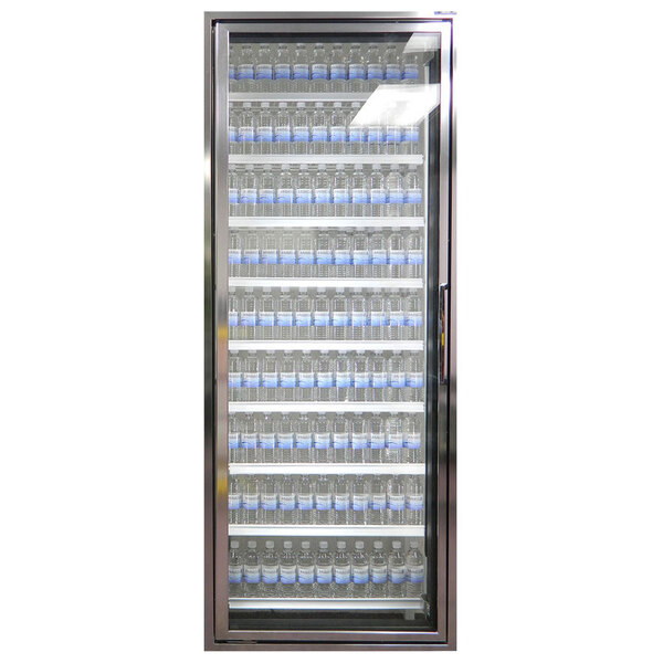 A Styleline walk-in freezer merchandiser door with shelves and water bottles inside.