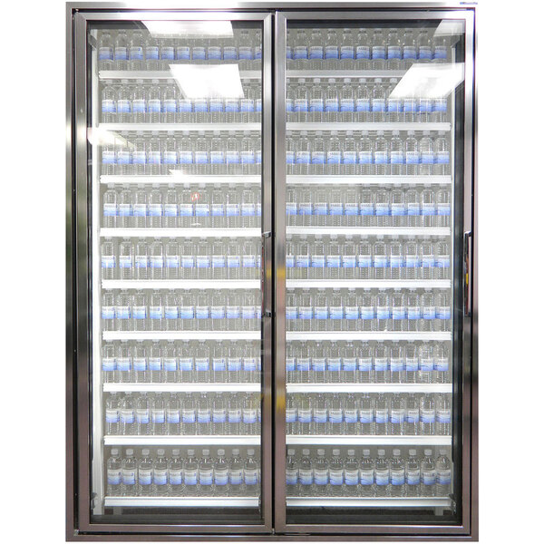 A Styleline walk-in freezer merchandiser with glass doors containing bottles of water.