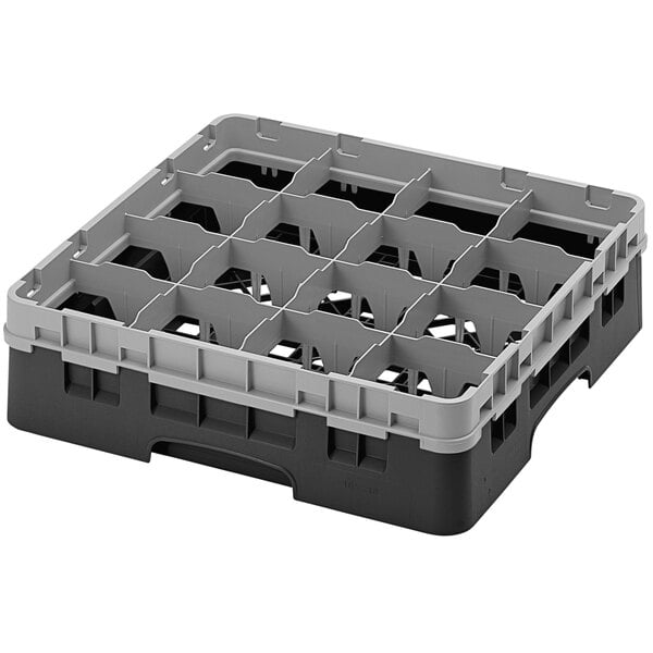 A black plastic Cambro glass rack with sixteen compartments.