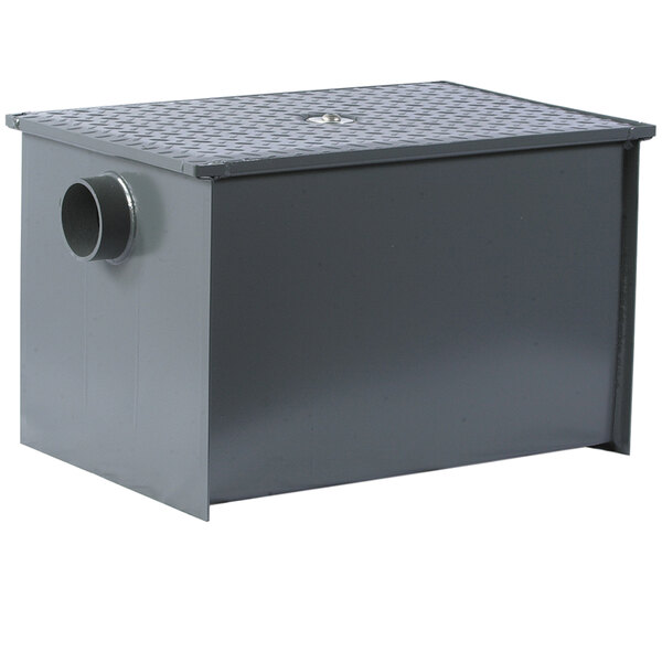 A grey rectangular Watts grease trap with a drain hole.