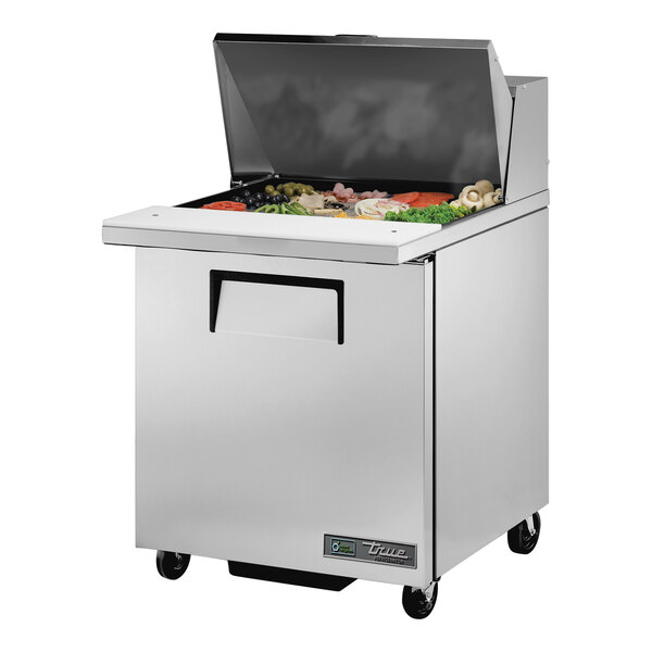 A True stainless steel refrigerated sandwich prep table with a large compartment on the counter.