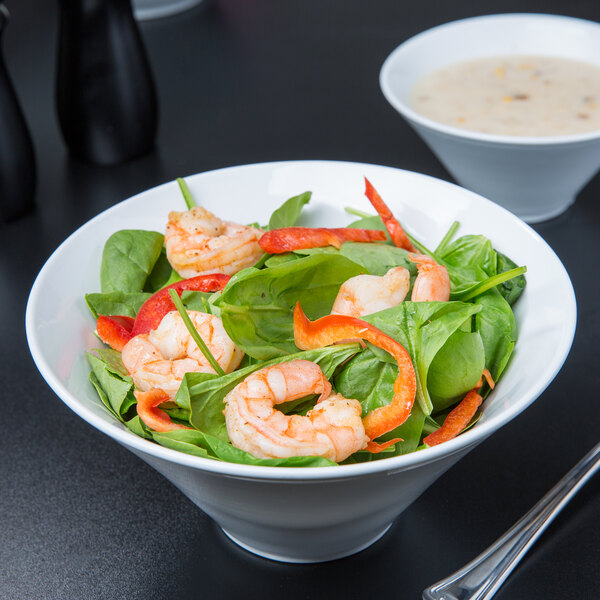A close up of a Libbey Ultra Bright White porcelain bowl filled with shrimp and vegetable salad.