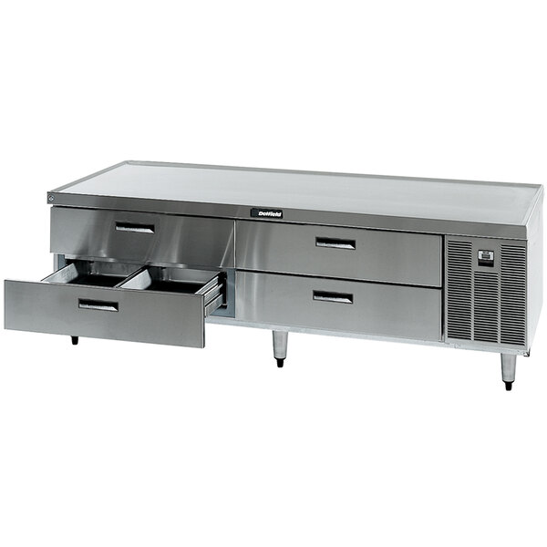 A Delfield stainless steel refrigerated chef base with four drawers.
