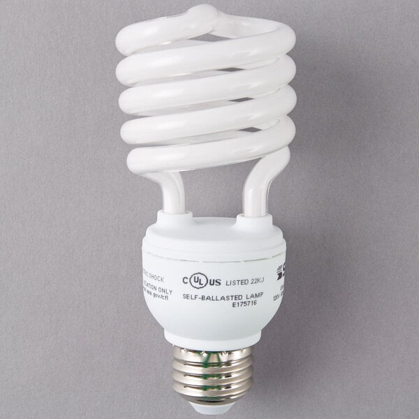 A close-up of a white spiral Satco compact fluorescent light bulb.