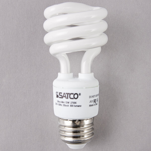 A close-up of a Satco white spiral compact fluorescent light bulb.