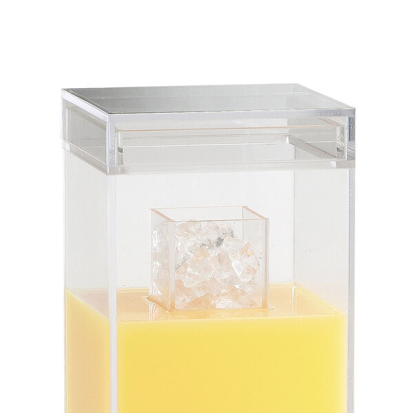 A clear plastic lid on a clear plastic container filled with yellow liquid.