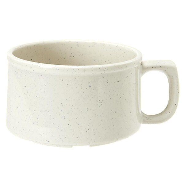 A white speckled mug with a handle.