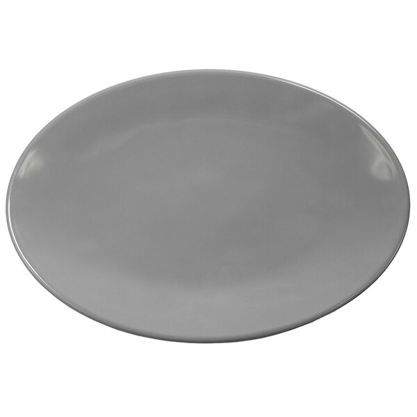 A grey oval melamine plate with a white background.