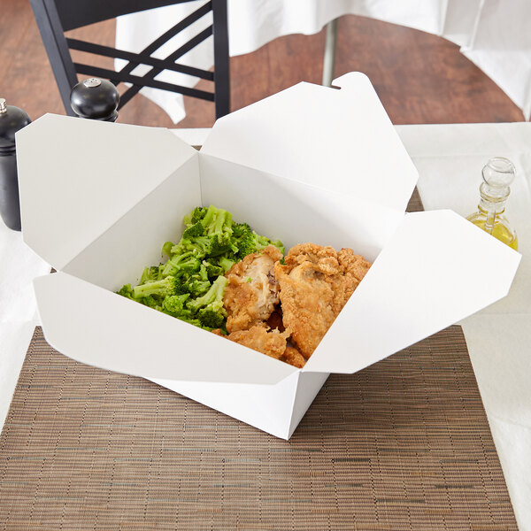 A white Fold-Pak Bio-Pak take-out box filled with chicken and broccoli.