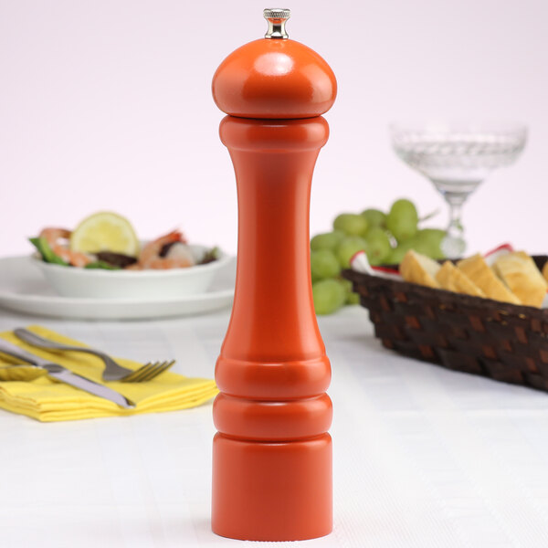 A Chef Specialties Butternut Orange Pepper Mill on a table.