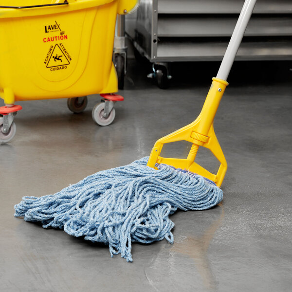 A blue Rubbermaid wet mop with a white universal headband in a yellow bucket.