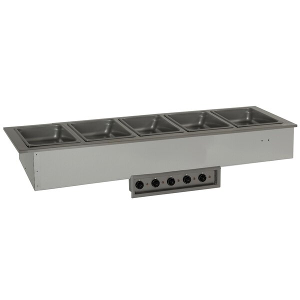 A Delfield stainless steel drop-in hot food well with four compartments.