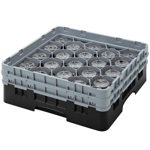 A black and grey plastic Cambro glass rack with clear glassware inside.