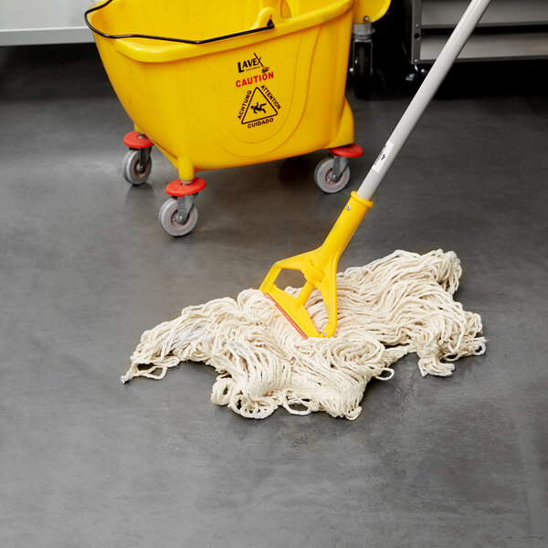 A white Rubbermaid wet mop in a yellow bucket.