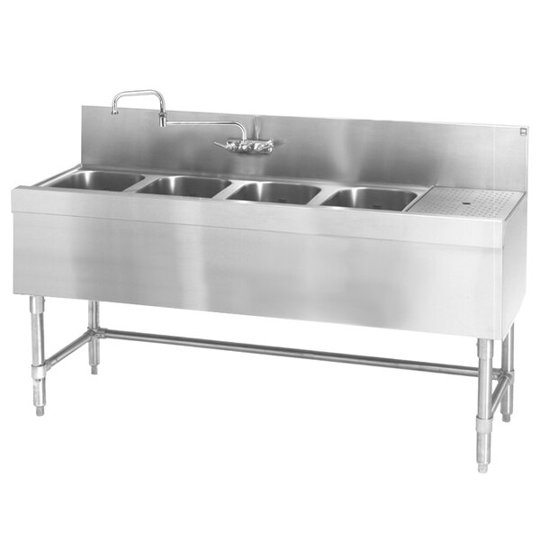 An Eagle Group stainless steel underbar sink with four bowls and a right drainboard.