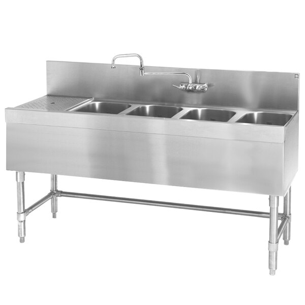 An Eagle Group stainless steel underbar sink with four bowls and a left drainboard.