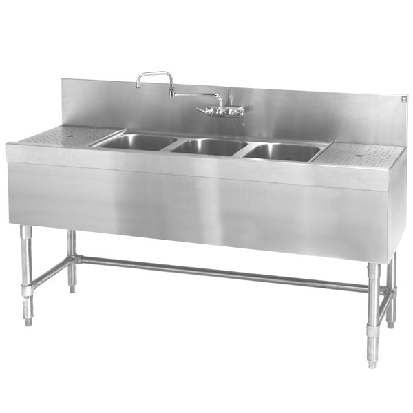 An Eagle Group stainless steel underbar sink with three bowls and two drainboards.