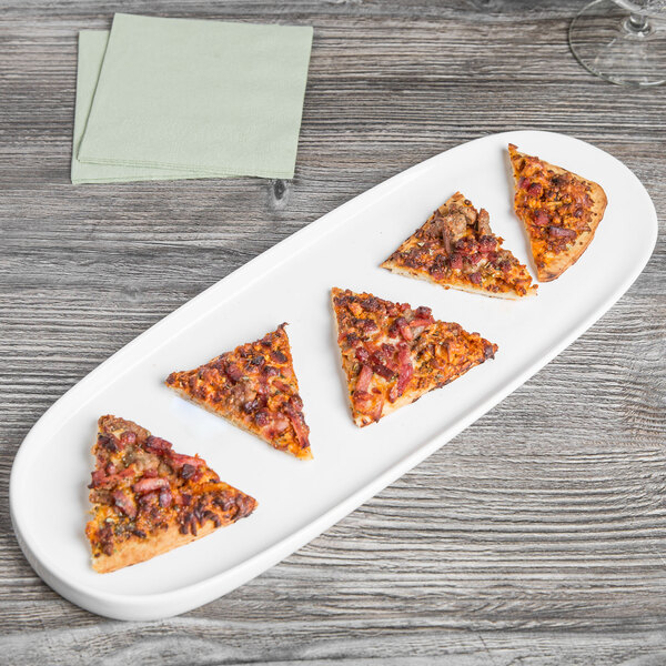 A slice of pizza with meat and cheese on a white Libbey porcelain tray.