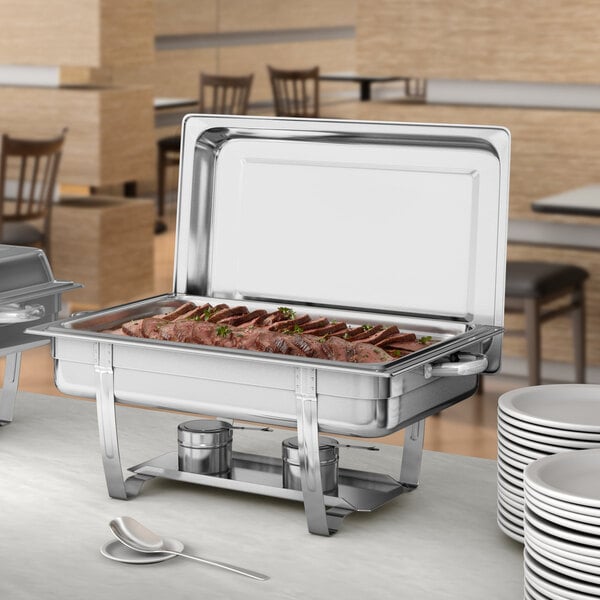 A stack of Choice Economy stainless steel chafers on a table.
