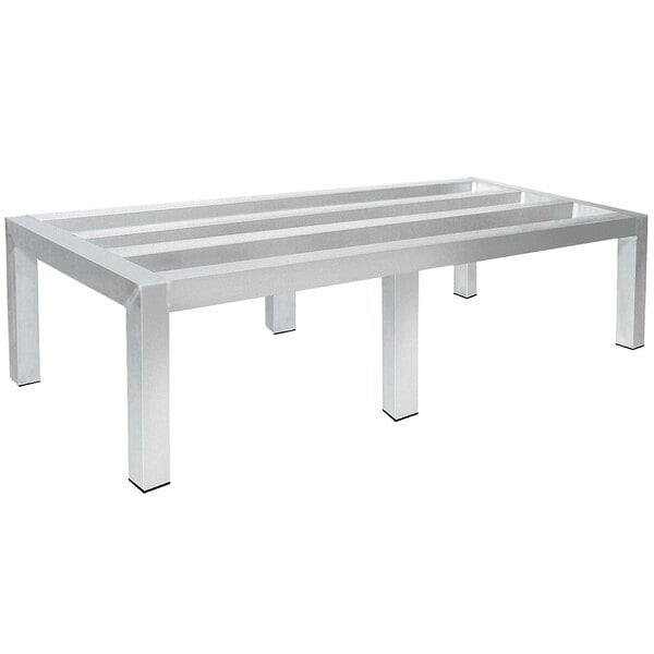 An Advance Tabco aluminum dunnage rack with four metal legs.