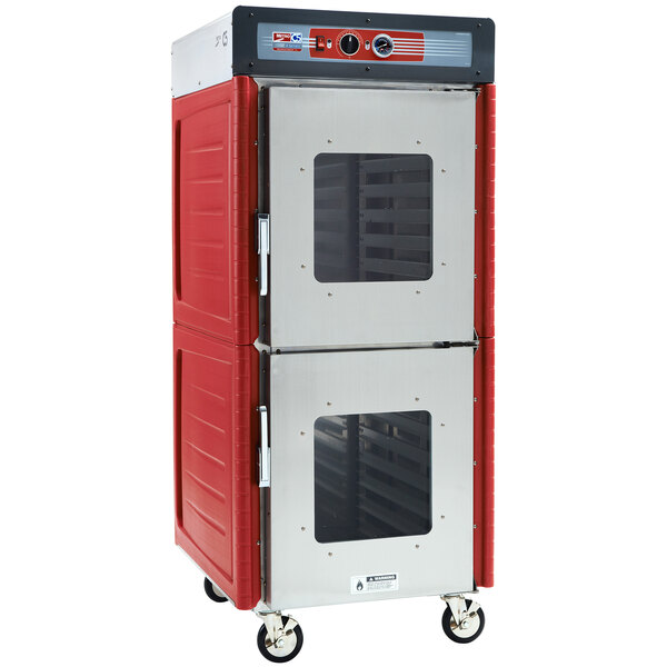 A red and silver Metro hot holding cabinet with clear Dutch doors.