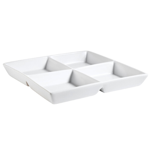 A bright white porcelain square dish with 4 compartments.