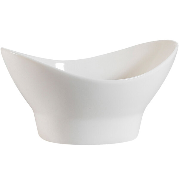 A CAC bone white porcelain nugget bowl with a curved bottom.