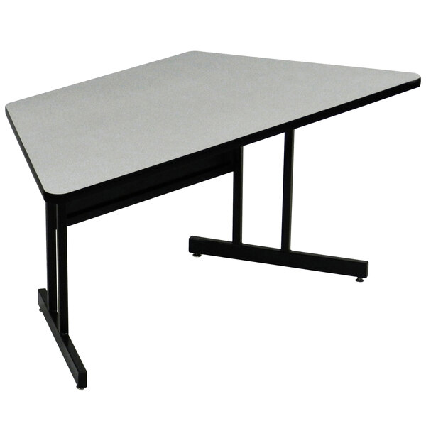 A grey trapezoid table top with black legs.