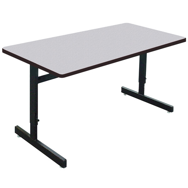 A rectangular Correll training table with black metal legs and a gray granite top.