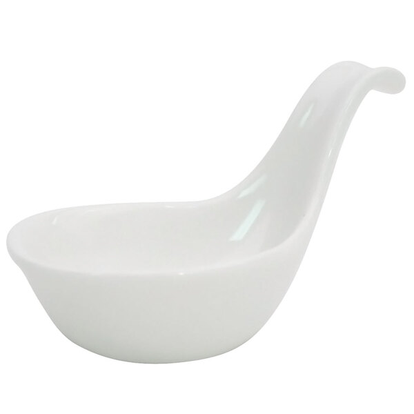 A CAC Bone White Porcelain mini bowl with a curved handle.