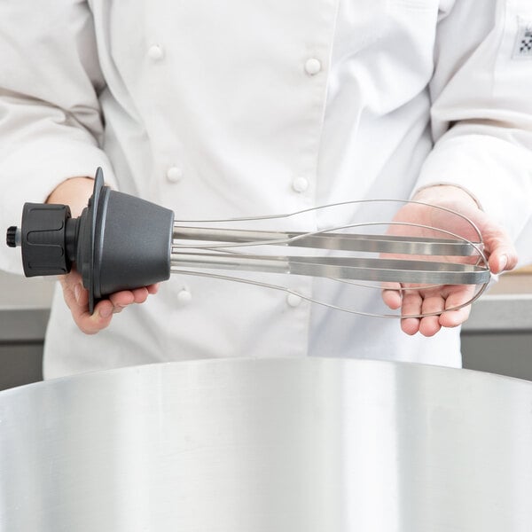 A person holding an AvaMix whisk.