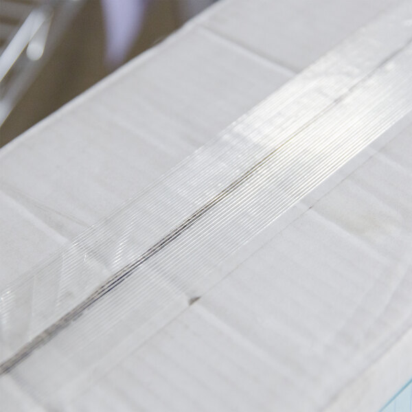 A white box of Shurtape fiberglass reinforced strapping tape with a clear plastic strip.