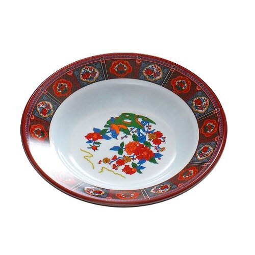 A Thunder Group melamine soup plate with a peacock design.