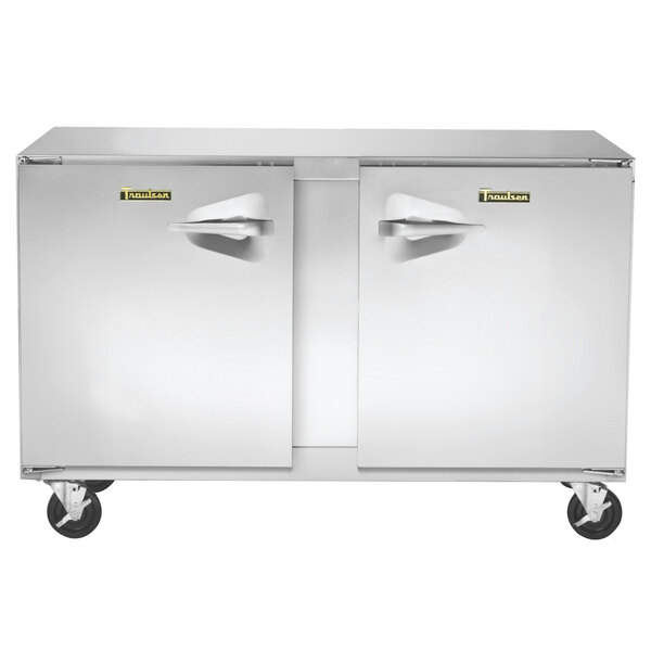 A Traulsen stainless steel undercounter freezer with left and right hinged doors and wheels.