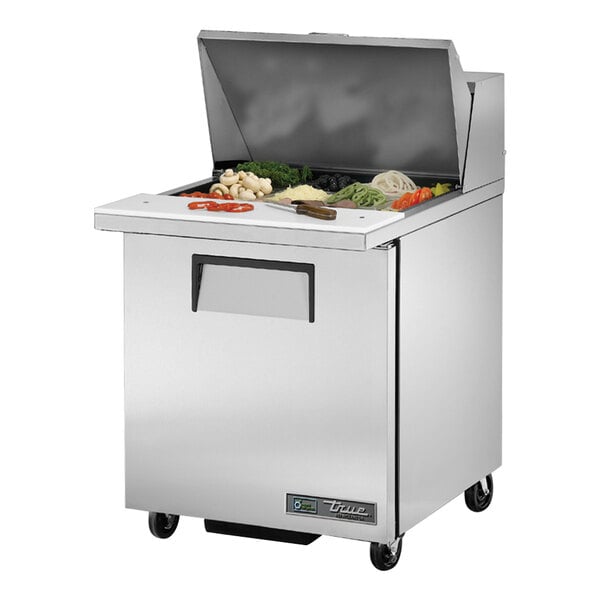 A True refrigerated sandwich prep table with a mega top on a counter.