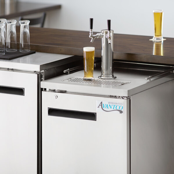 An Avantco stainless steel 2 tap beer tower on a counter.