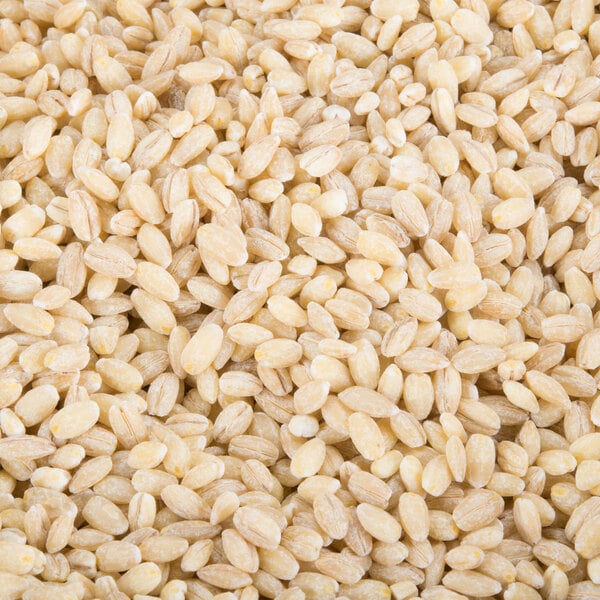 A pile of dried whole pearl barley.