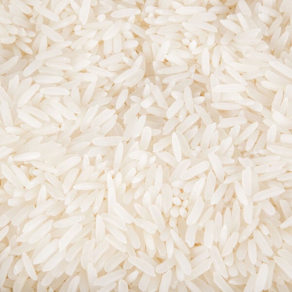 A pile of Organic White Jasmine Rice on a white background.