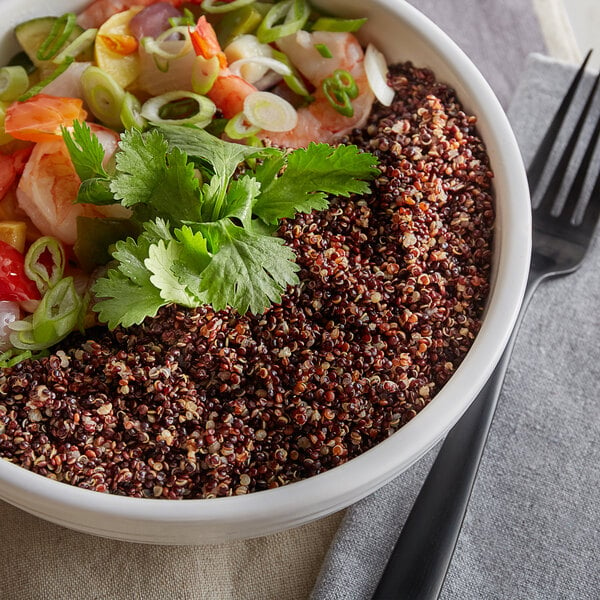 A bowl of Organic Black Quinoa with a fork.