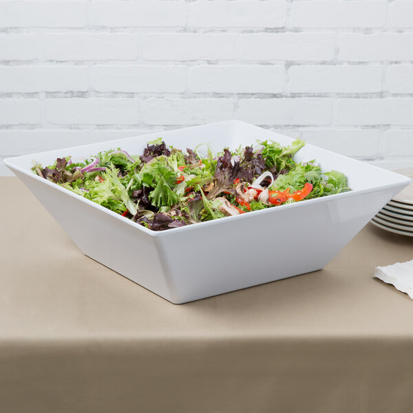 A white GET Siciliano square bowl with salad in it.