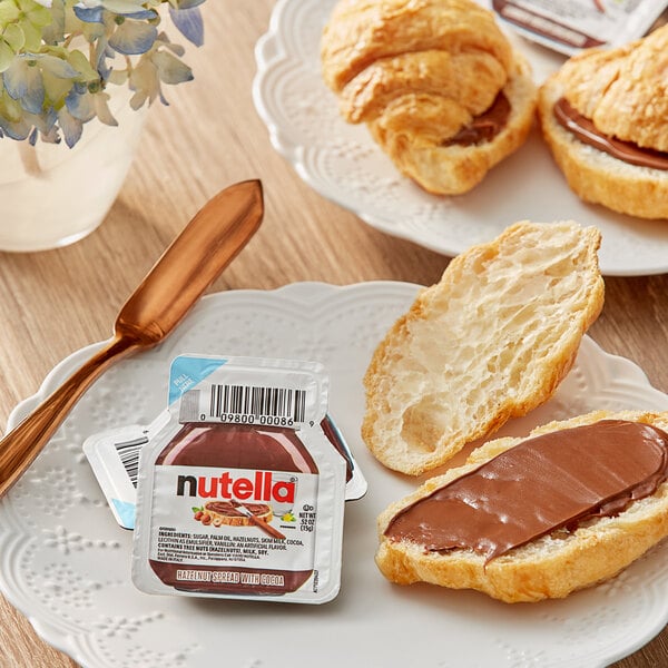 A plate with a croissant and Nutella.