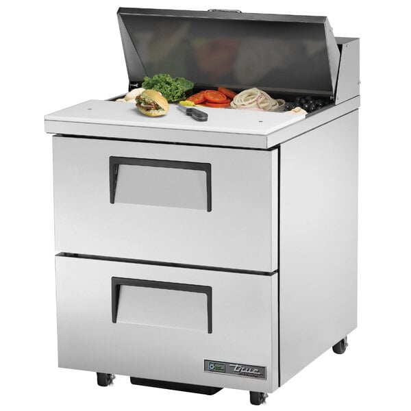 A True stainless steel refrigerated sandwich prep table with two drawers.